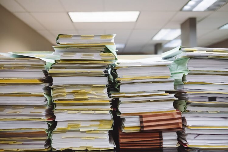 Stacks of paperwork organized in an office setting